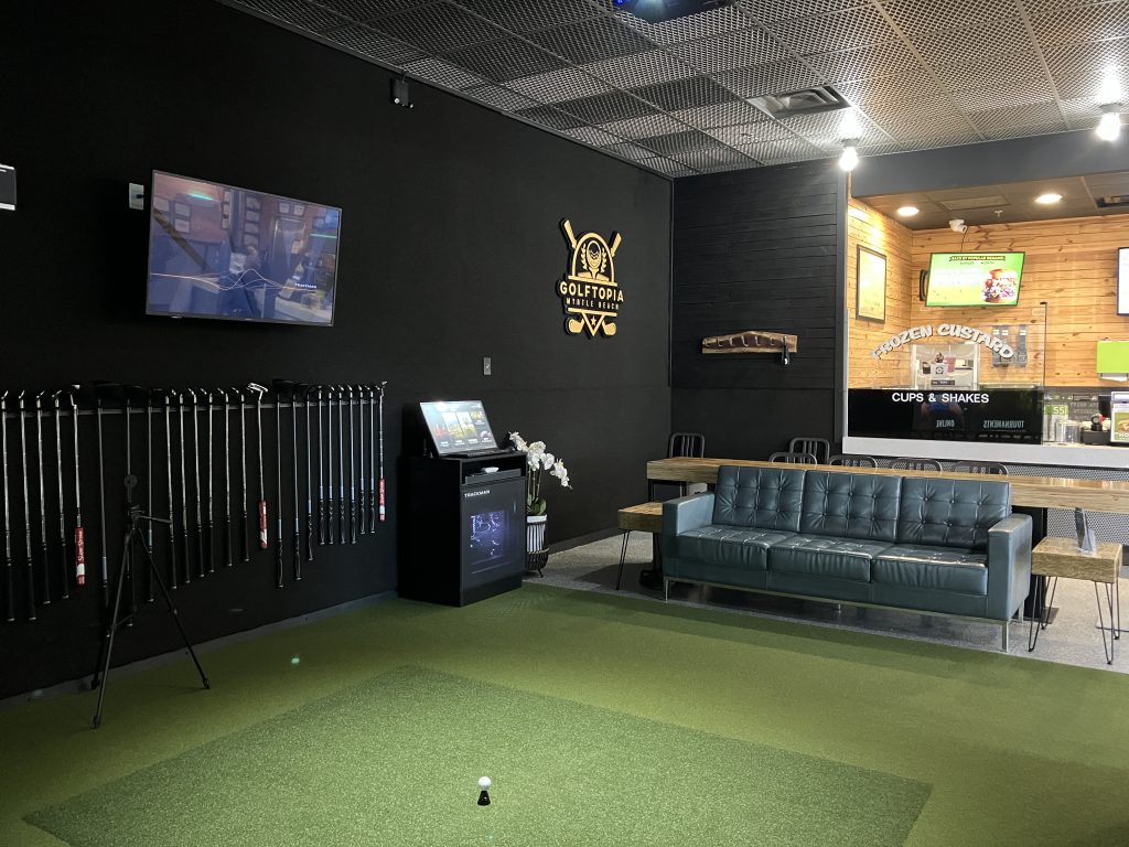 The Golftopia simulator room inside the BurgerFi restaurant at Sayebrook Town Center in Myrtle Beach