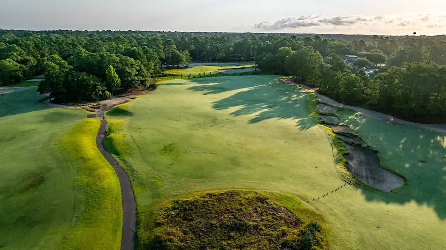 Wide sandy waste area beside a fairway at True Blue Golf Club in Pawleys Island